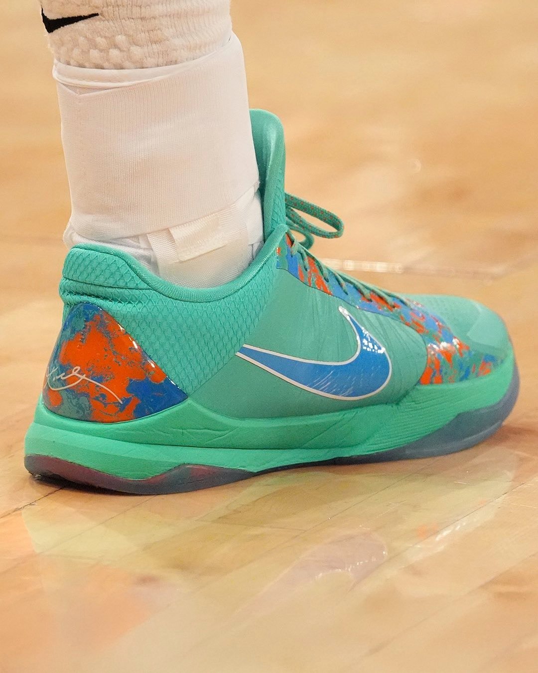 Jalen Brunson x Nike Kobe 5 Protro PE in the NY vs NY colorway, showing side and detail views of the exclusive player edition basketball sneaker - detail view 1