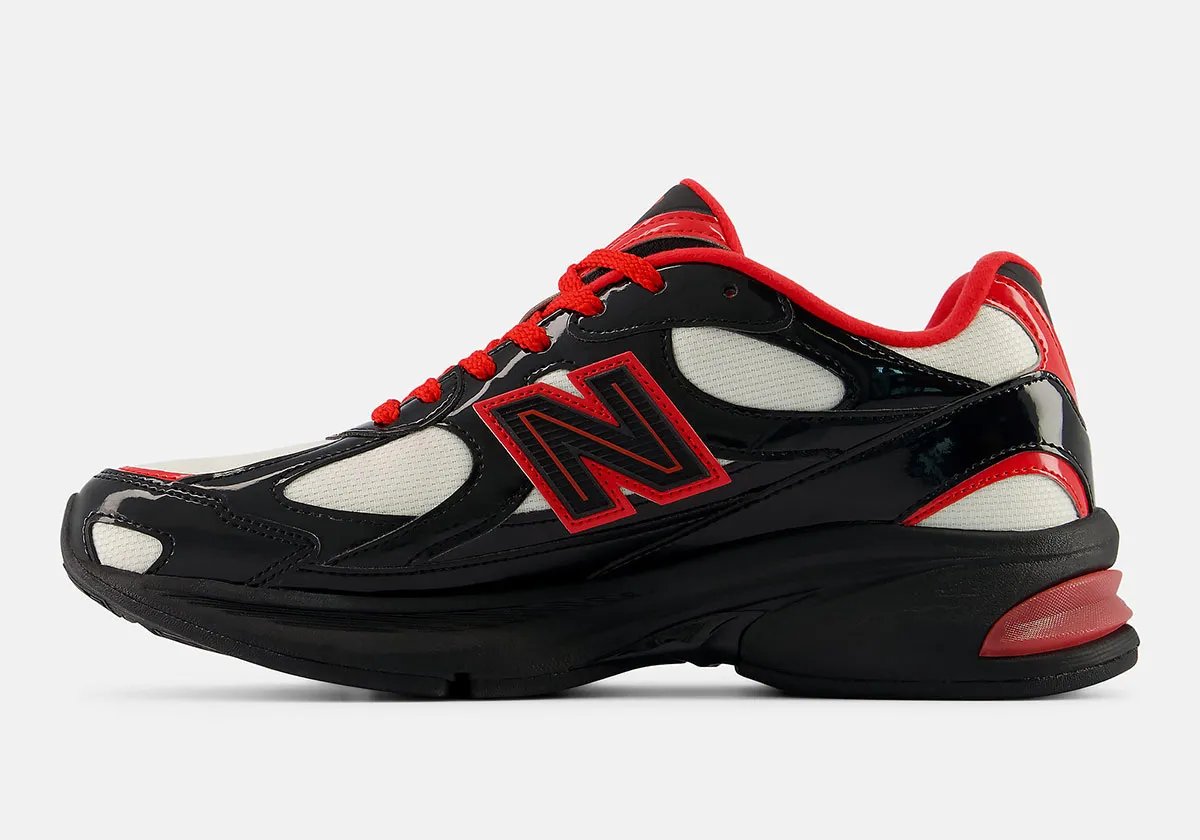 New Balance 2010 Firecracker colorway featuring off-white mesh, jet black patent leather, and fire red accents - detail view 2