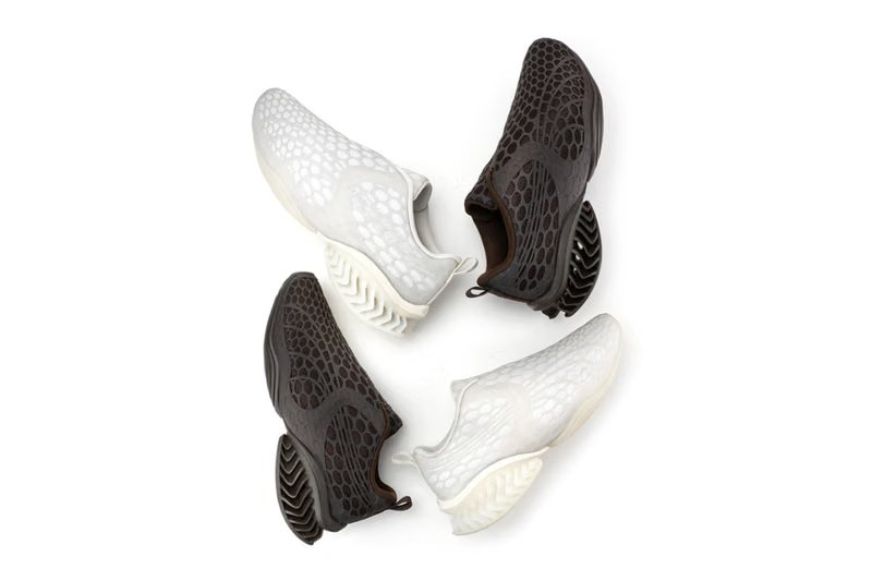 Puma x _J.L-A.L CELL GEO 1 CAGE JL-AL in dark brown and white, featuring geometric 3D TPU cage overlay on breathable mesh upper - detail view 3