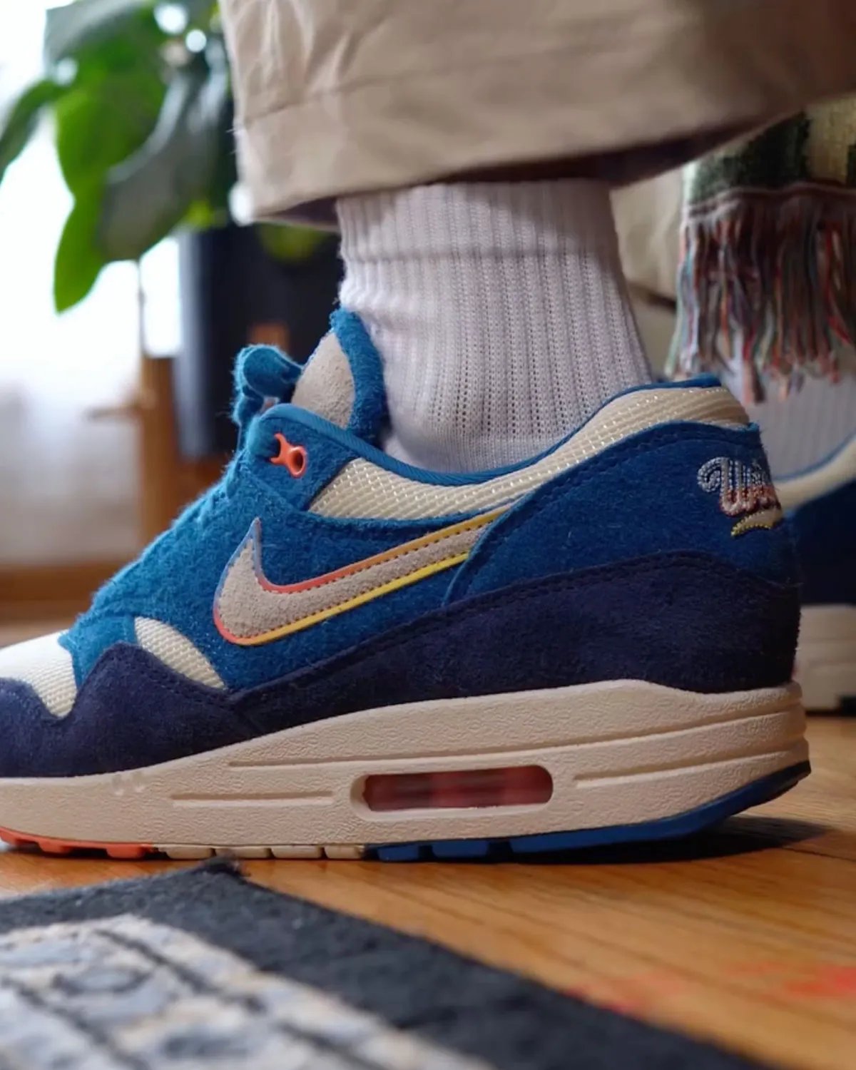 Nike Air Max 1 in Brewers City Connect colorway featuring blue suede upper with rainbow-trimmed Swoosh - detail view 1