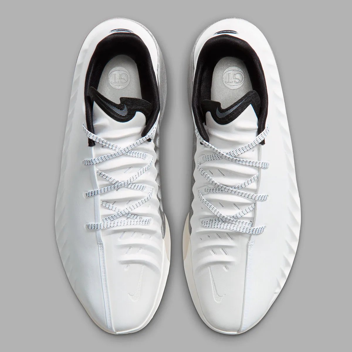 Nike GT Cut 4 SE in Summit White colorway featuring white synthetic upper, black interior, brushed metallic silver heel, and semi-translucent outsole - detail view 4