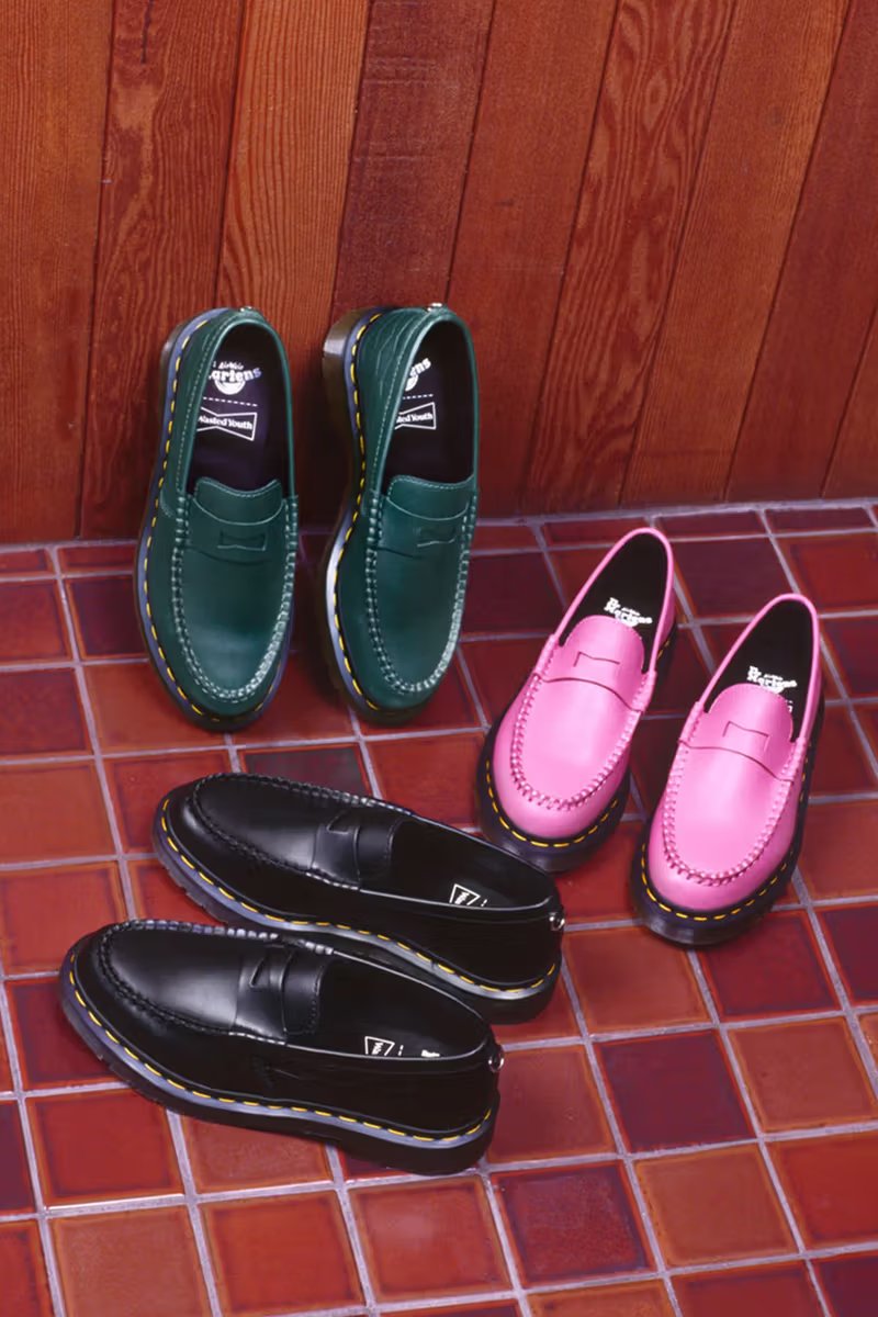 Dr. Martens x Wasted Youth Penton Loafer in black leather with embossed bowtie logo motif and yellow welt stitching - detail view 2