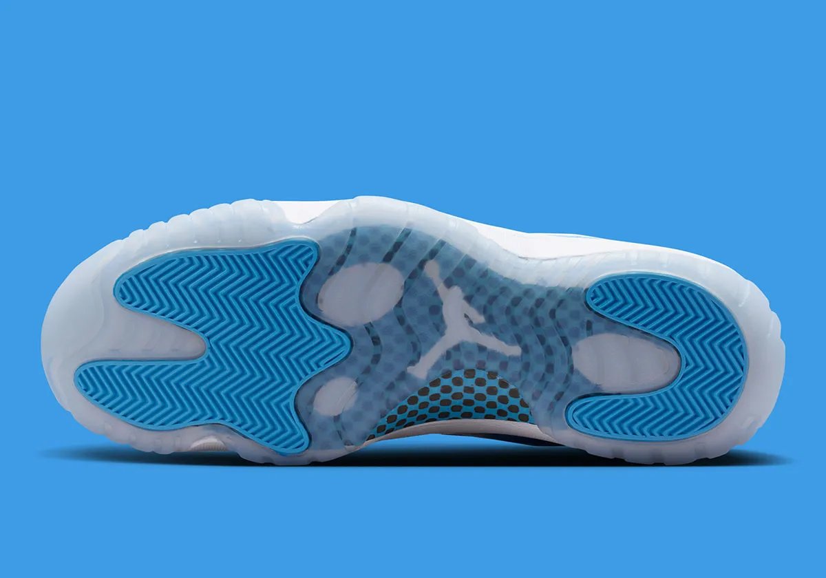 Air Jordan 11 Low in University Blue and white, showing mudguard detail and icy translucent sole - detail view 5