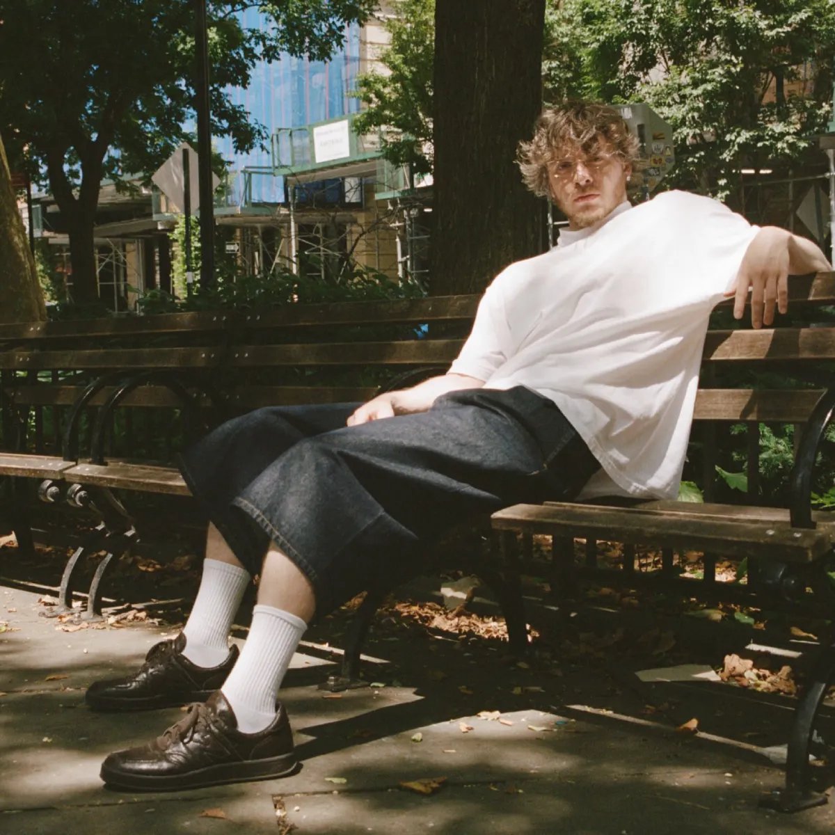 Jack Harlow x New Balance T500 "Olmsted" in Black Coffee leather, shown from the side profile highlighting the soft wrinkled upper and brown midsole. - detail view 2