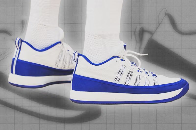 College basketball players in premium sneakers during NCAA tournament warm-ups and tunnel walks - detail view 1