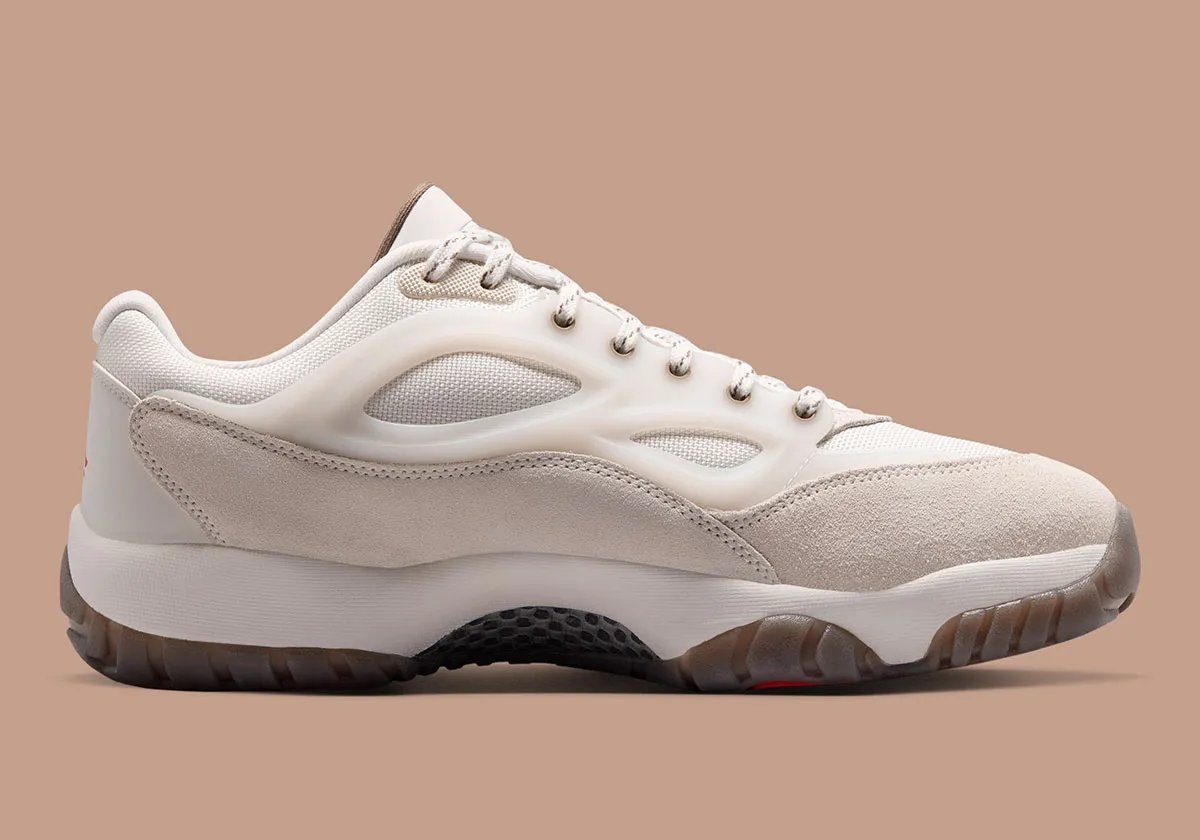 Jordan Dimension 95 Phantom showing perforated TPU cage, suede toe cap, and Red Swan outsole detailing - detail view 3