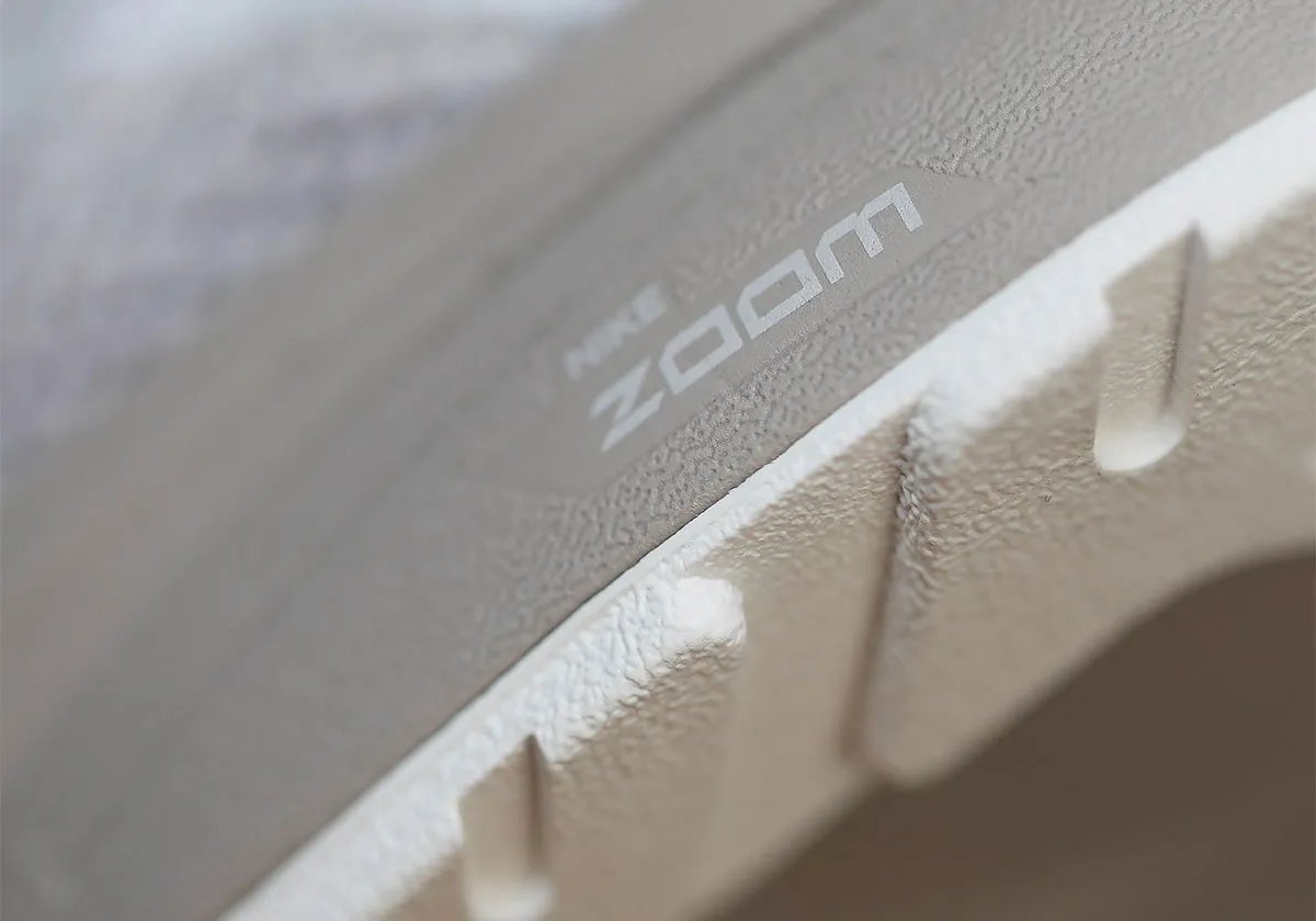 Nike Zoom Streak 3 in Cream II/Sail colorway, showing the flush upper construction and neutral palette of the 2009 performance runner returning as a lifestyle model - detail view 2
