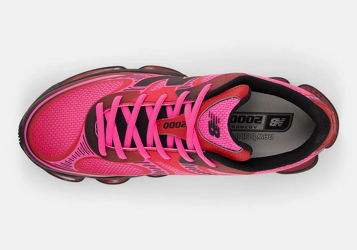 New Balance 2000 in Pink Heat colorway, showcasing the bulbous toe box and stacked midsole geometry with mesh and synthetic upper construction - detail view 2
