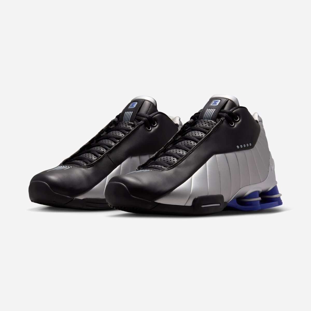 Nike Shox BB4 in Black and Metallic Silver colorway, showcasing the classic Shox cushioning platform and court-ready silhouette - detail view 1
