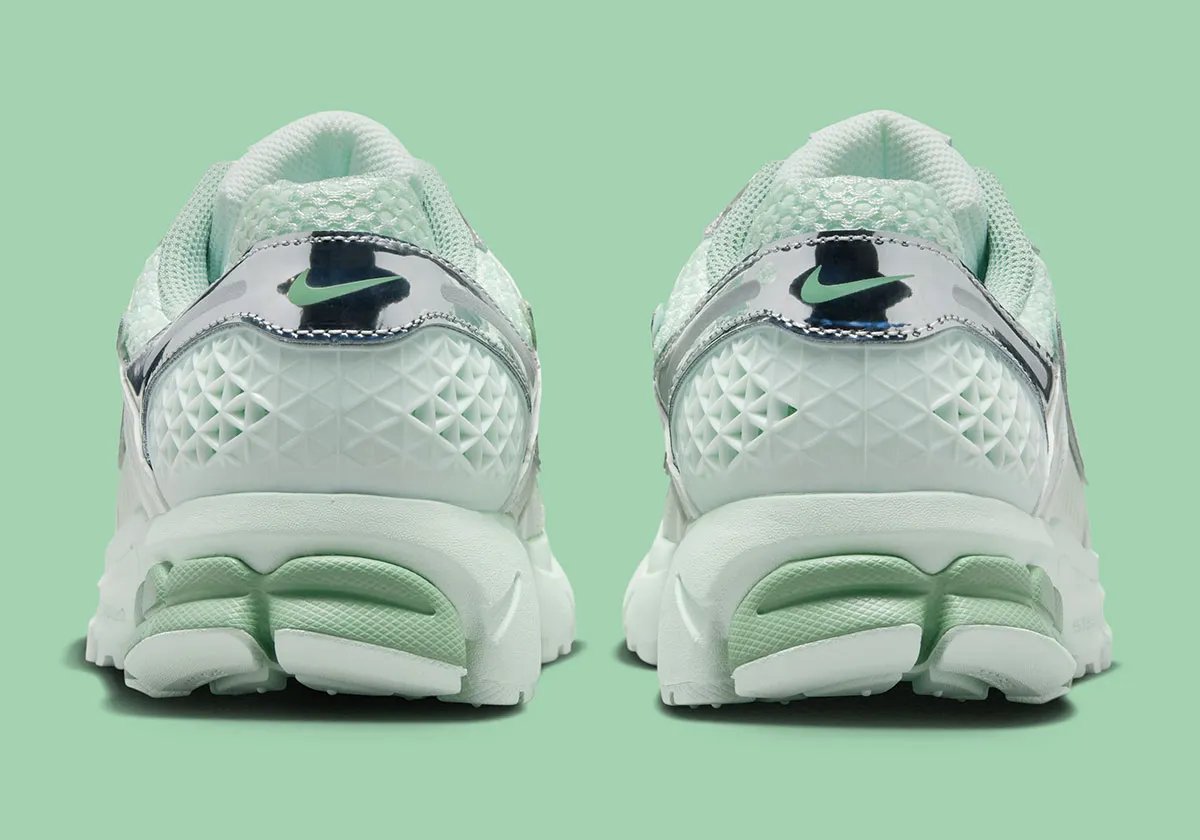Nike Zoom Vomero 5 in Barely Green with metallic silver chrome accents and dual Swoosh detail - detail view 5