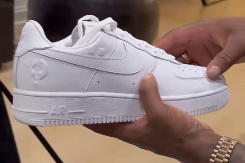JAY-Z x Nike Air Force 1 Low 'Reasonable Doubt' triple-white sneaker with embossed Roc-A-Fella branding and custom heel graphics - detail view 4
