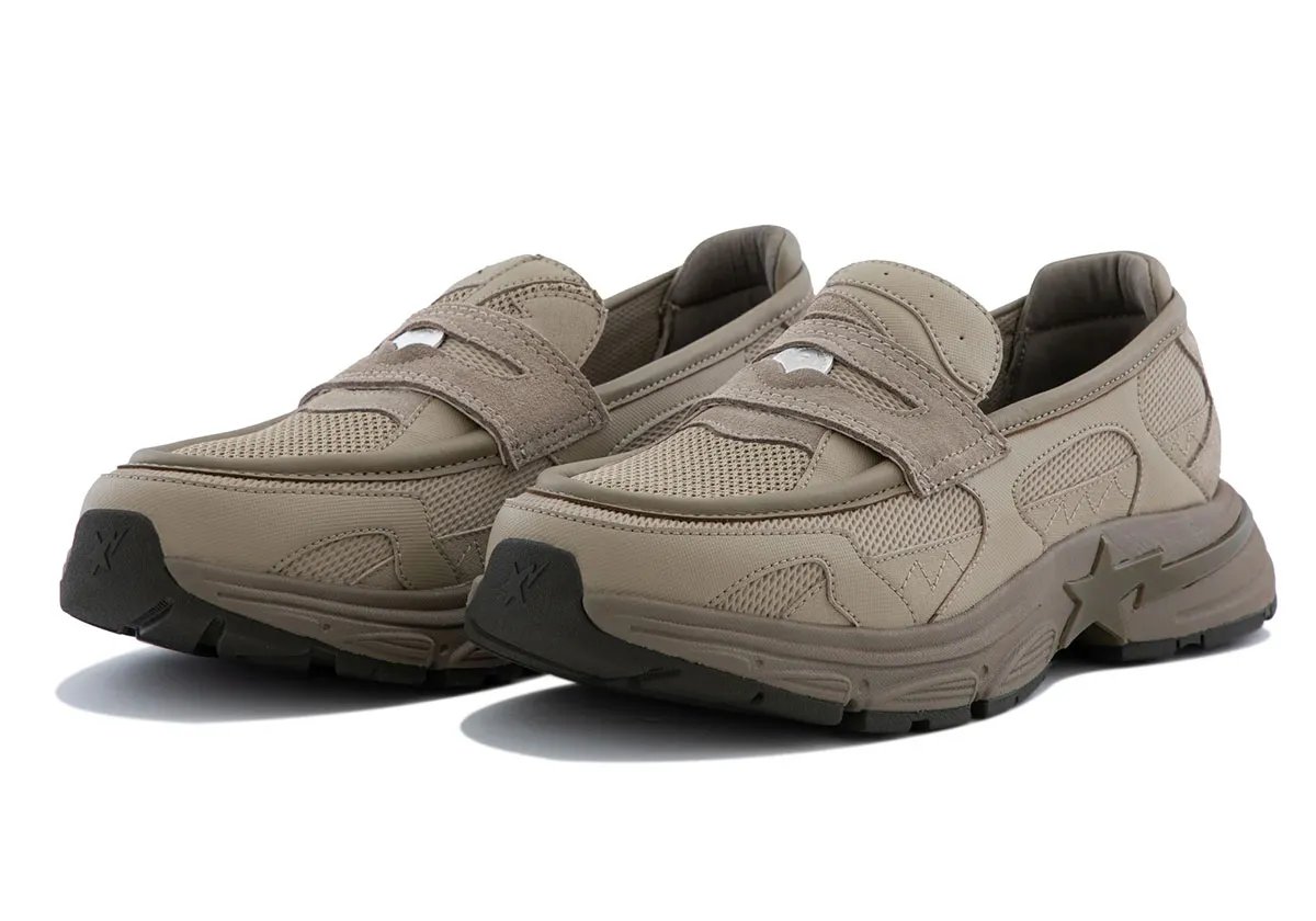 BAPE Loafer STA in light brown colorway, showing laceless loafer upper with textured pocked material and jagged mudguard detailing - detail view 4