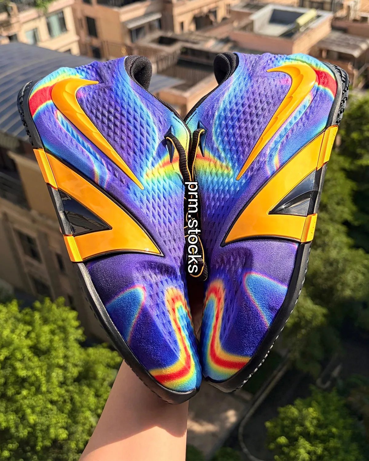 Nike Ja 4 "Radar" featuring thermal-inspired upper with red, yellow, blue, and aqua across deep purple base with bright orange Swoosh - detail view 2