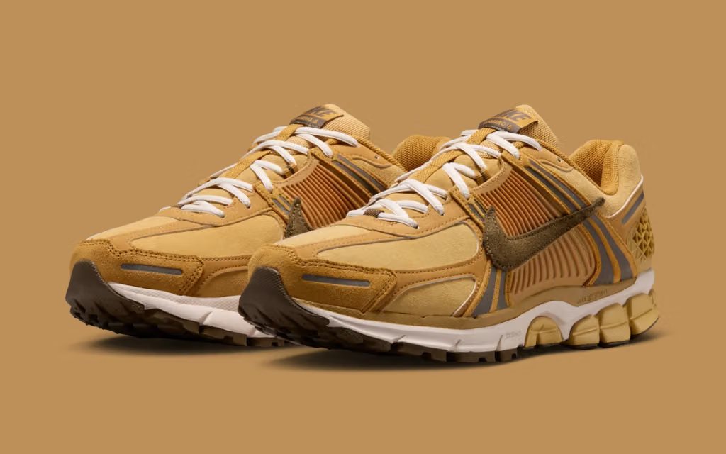 Nike Vomero 5 in Wheat Gold colorway, showcasing the cushioned midsole and neutral upper construction