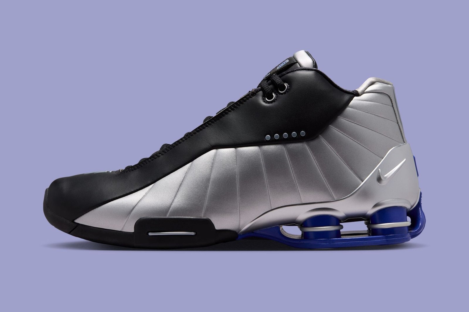 Nike Shox BB4 in Black and Metallic Silver colorway, showcasing the classic Shox cushioning platform and court-ready silhouette