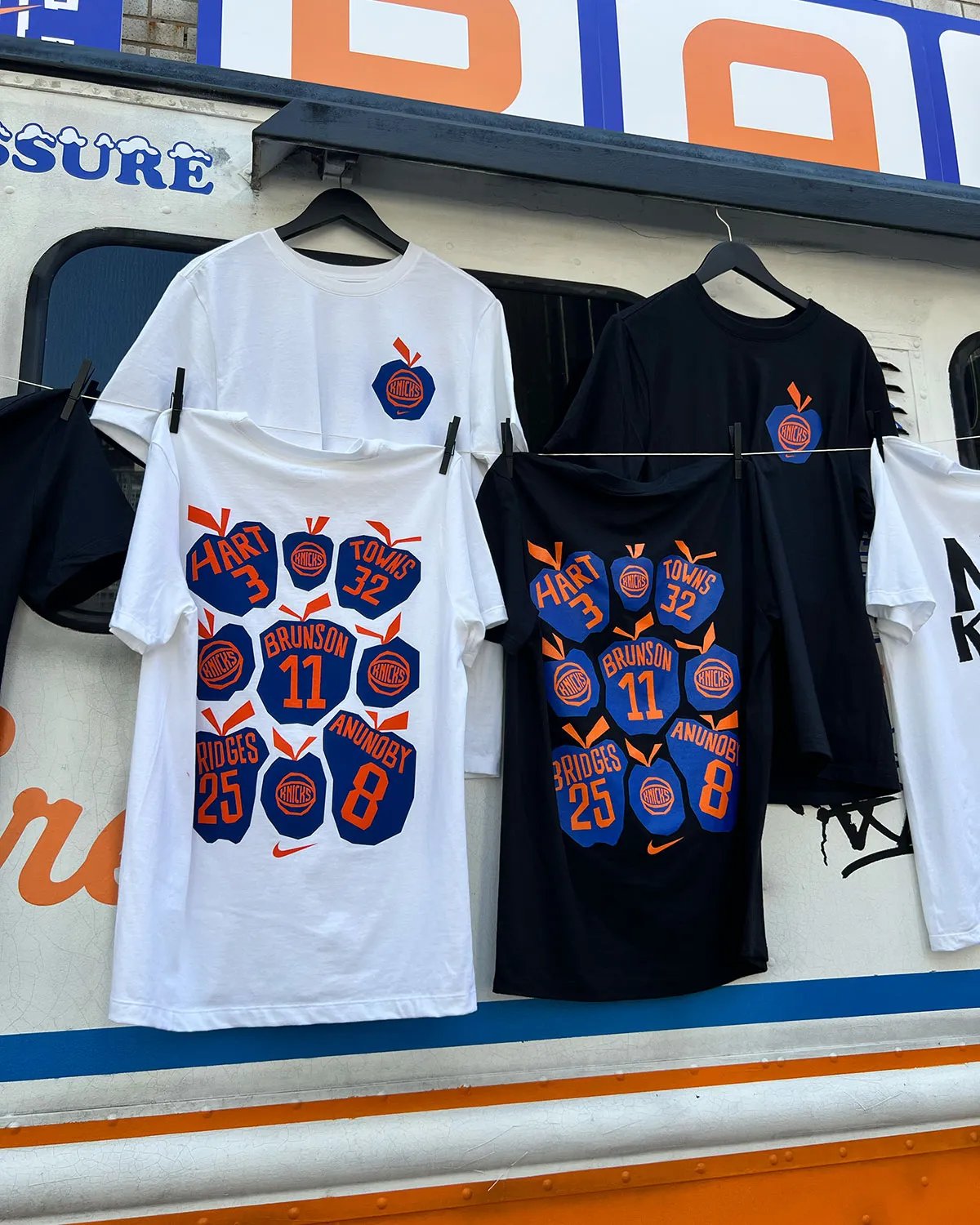 Nike Park N Shop pop-up activation inside Park N Lock garage near Madison Square Garden, featuring custom orange and blue ice cream truck design with vintage Knicks merchandise and hanging Nike Dunks - detail view 1