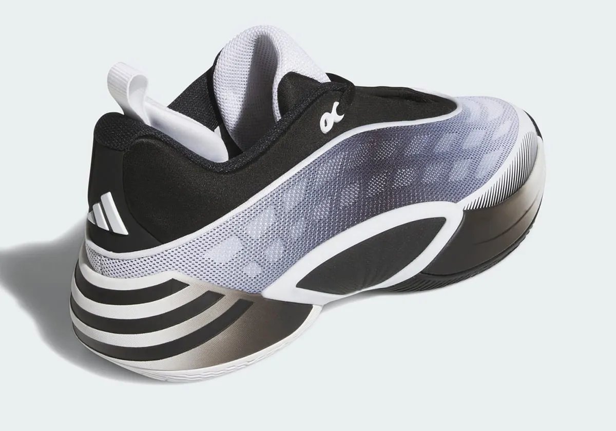 adidas D.O.N. Issue #8 'Yin and Yang' colorway showing inverted black and white design across both shoes - detail view 1