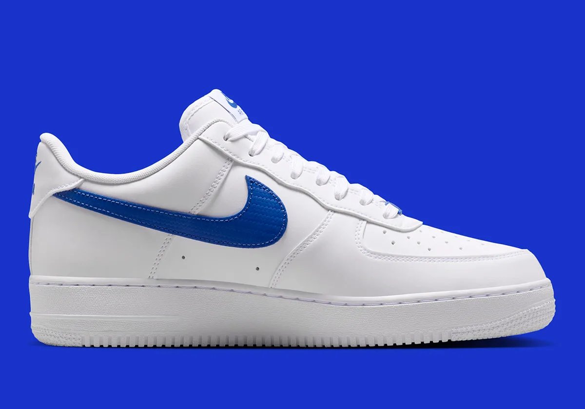 Nike Air Force 1 Low in White with Game Royal carbon fiber Swoosh and accents, lateral view - detail view 3
