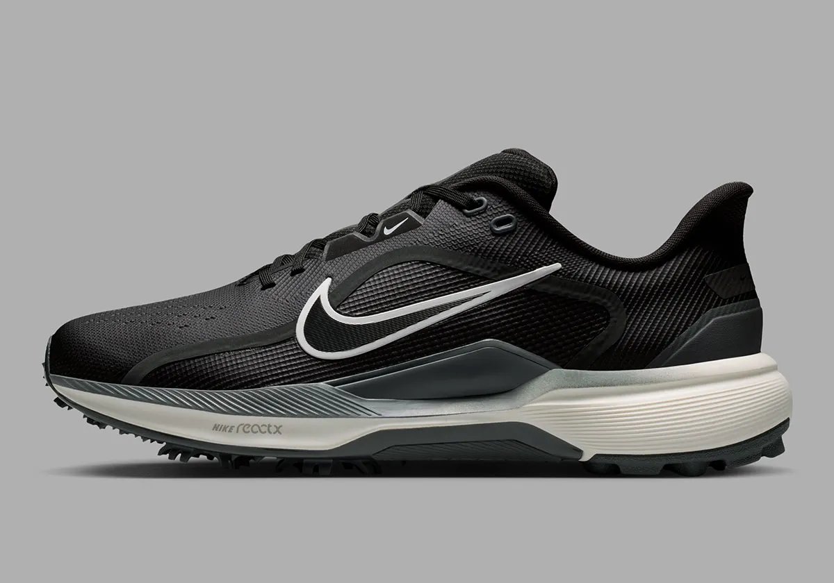 Nike Pegasus 1 Golf in black colorway, showing lateral support plates and hybrid traction system - detail view 1