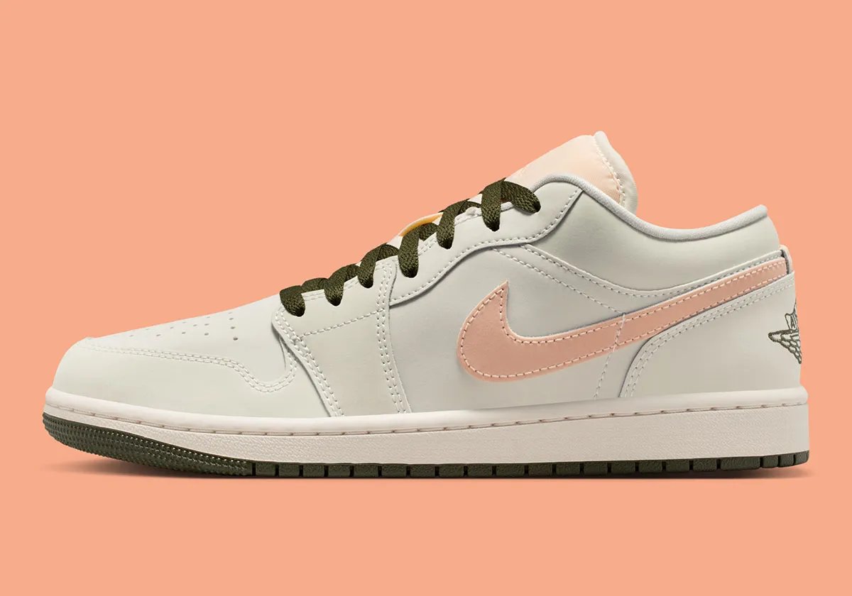 Nike Air Jordan 1 Low in Crimson Tint colorway, showing leather construction and ankle collar detail - detail view 1