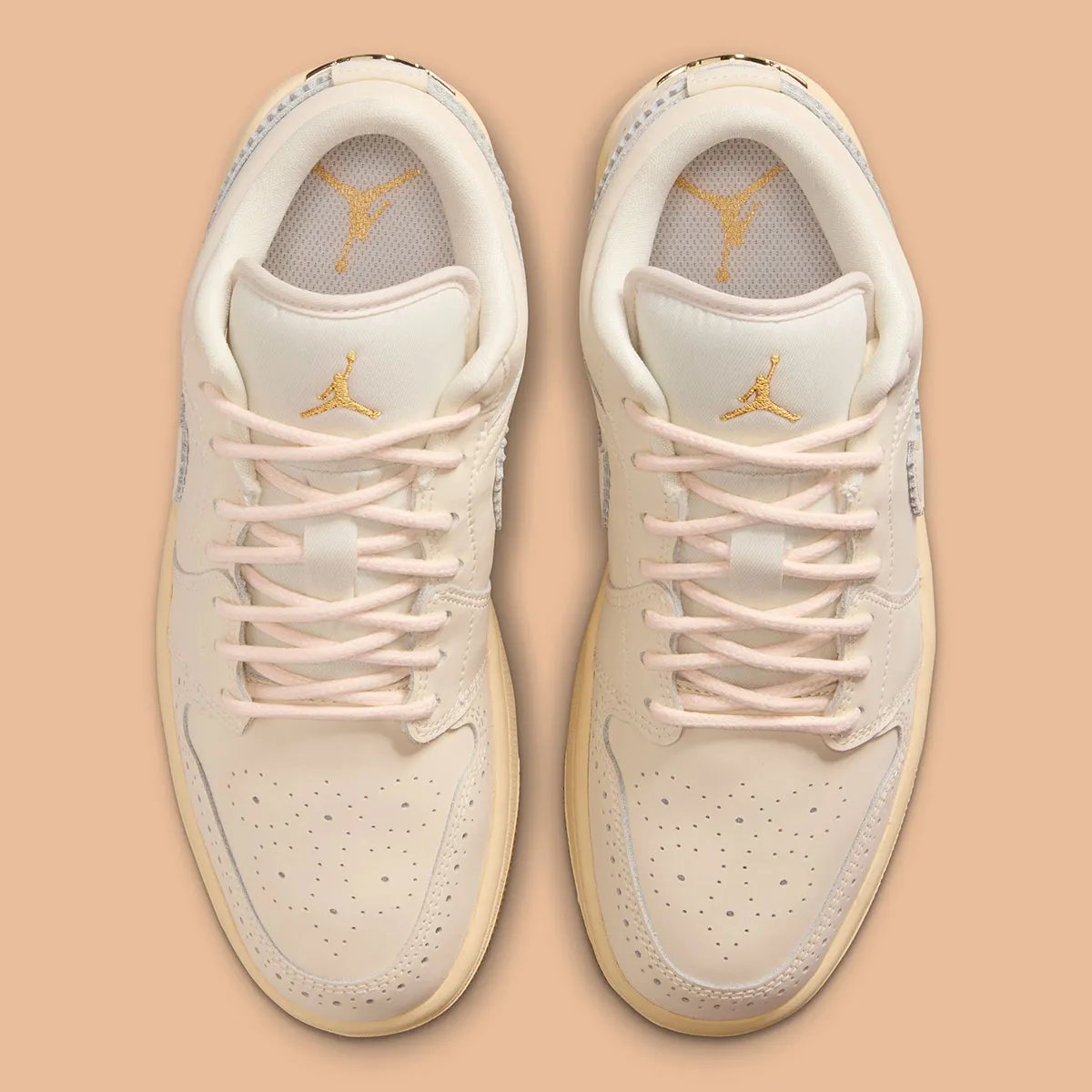 Air Jordan 1 Low in Brogue colorway featuring off-white leather with gold embroidery and rope laces - detail view 3