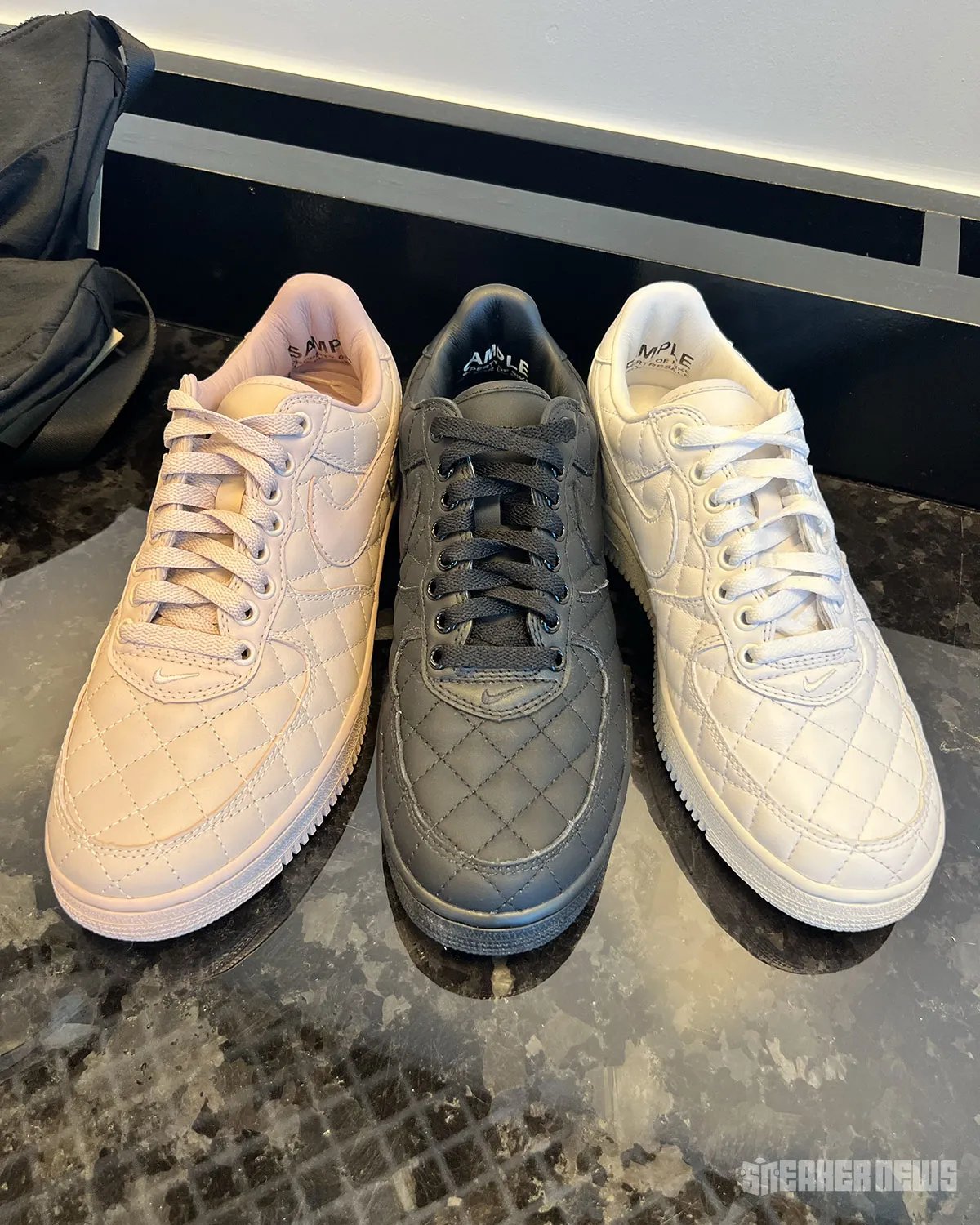 Nike Air Force 1 Low Quilted in triple white, featuring crosstitch detailing across the upper and matte leather collar - detail view 1