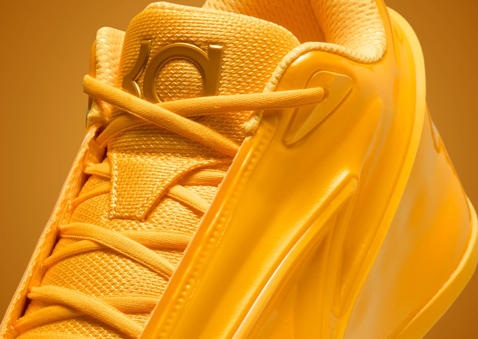 Nike KD 19 Butter Candy in monochrome yellow with green interior accents, part of the Candy Pack collection releasing Fall 2026 - detail view 2