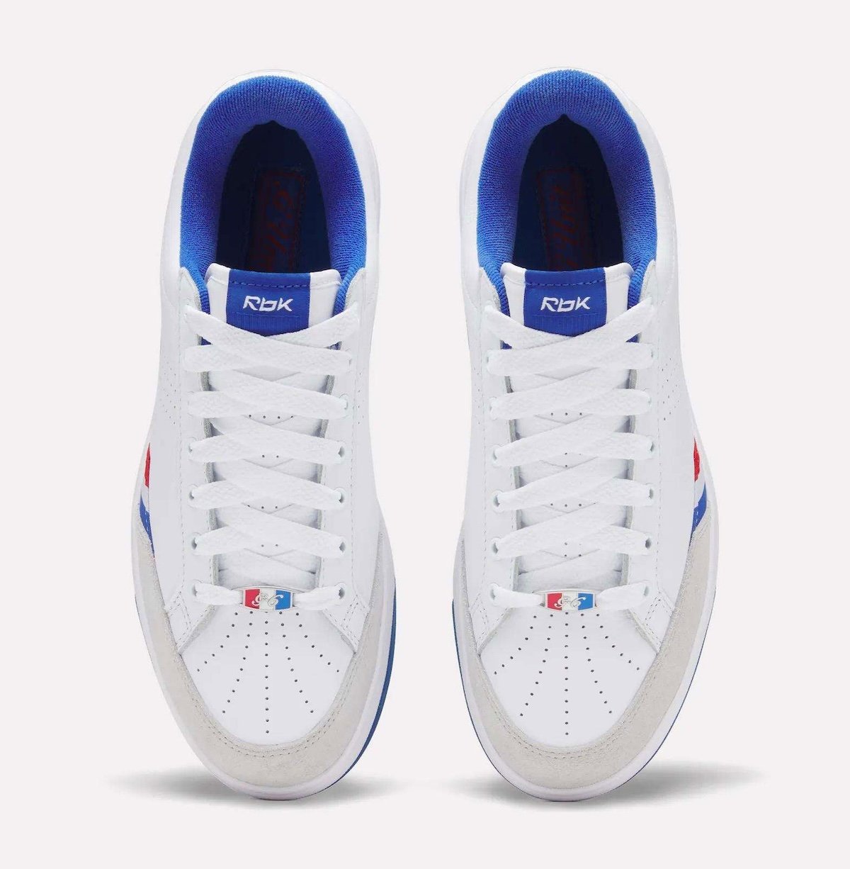Reebok G-Unit G6 retro sneaker in white leather with light grey suede toe and royal blue accents, releasing August 2026 - detail view 4