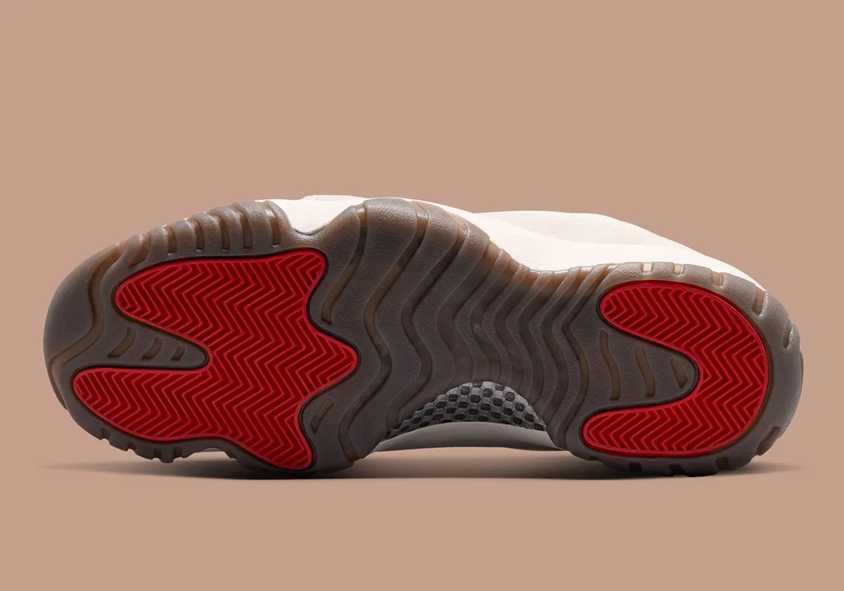 Jordan Dimension 95 Phantom showing perforated TPU cage, suede toe cap, and Red Swan outsole detailing - detail view 2