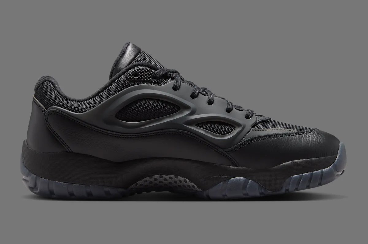 Jordan DMSN 95 in Black/Dark Smoke Grey showing mesh upper and molded TPU cage detail - detail view 4