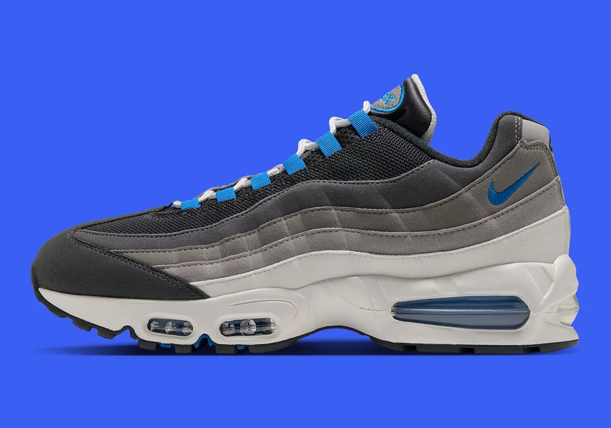 Nike Air Max 95 "Reverse Blue Spark" featuring inverted colorway with Blue Spark accents on Swoosh, tongue, and Big Bubble Air unit, white midsole, and black tongue - detail view 1