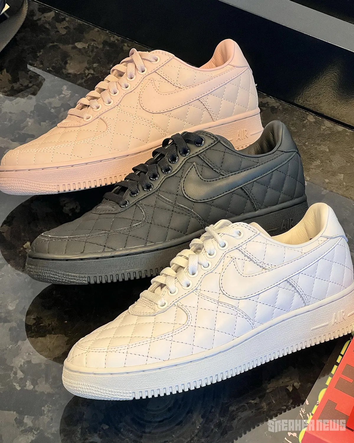 Nike Air Force 1 Low Quilted in triple white, featuring crosstitch detailing across the upper and matte leather collar - detail view 2