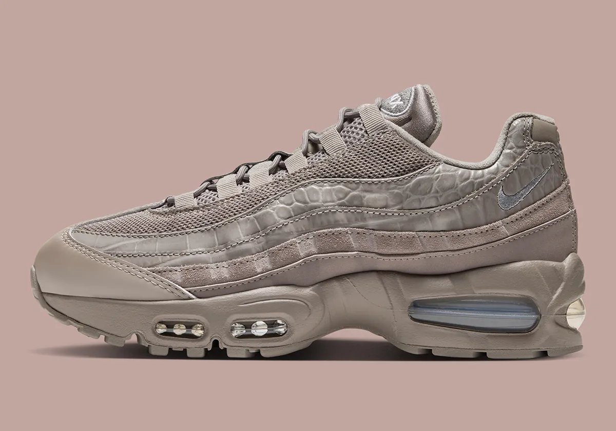 Nike Air Max 95 Enigma Stone women's sneaker featuring debossed croc leather side panels and hairy suede overlays - detail view 1
