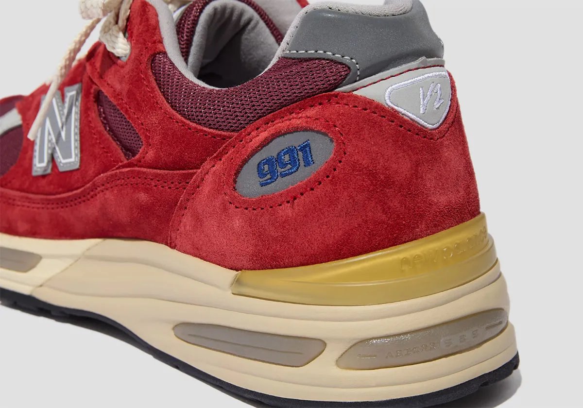 New Balance 991v2 in Karanda Red colorway featuring burgundy mesh and suede upper - detail view 2