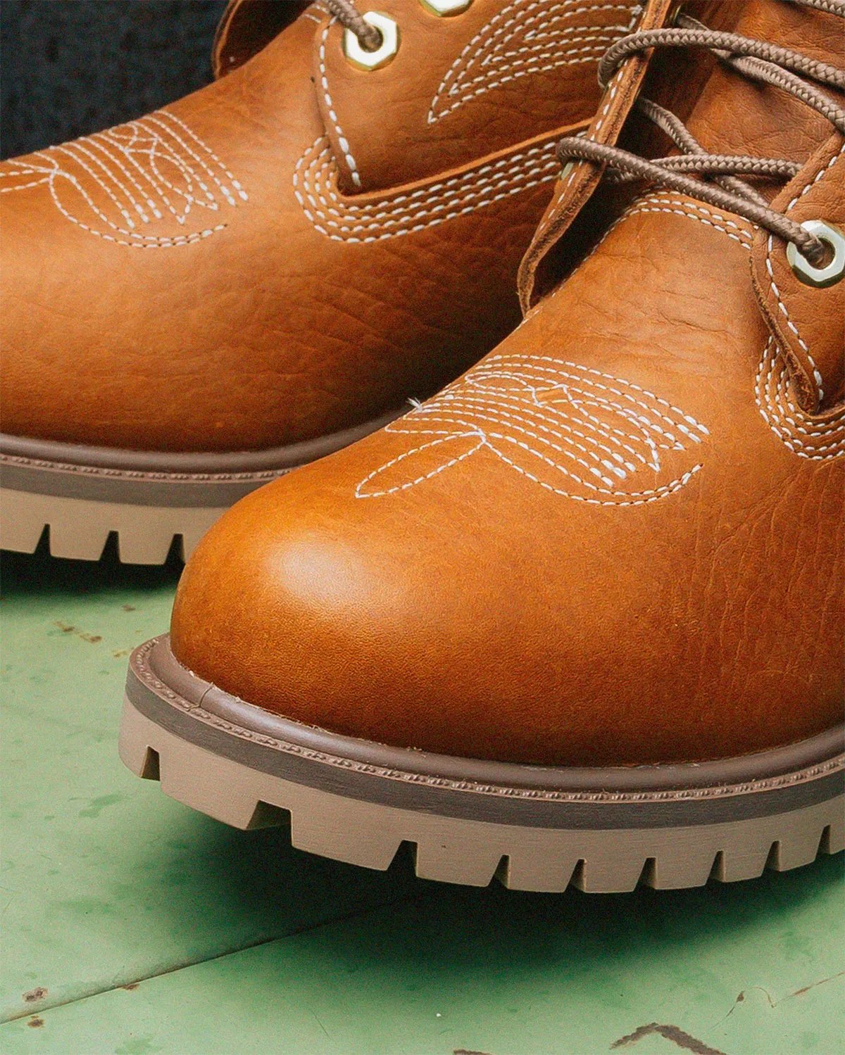 Sneaker Politics x Timberland 6-Inch Boot Outlaw and Rodeo editions featuring pebbled leather, Western stitching, and cow-print detailing - detail view 4