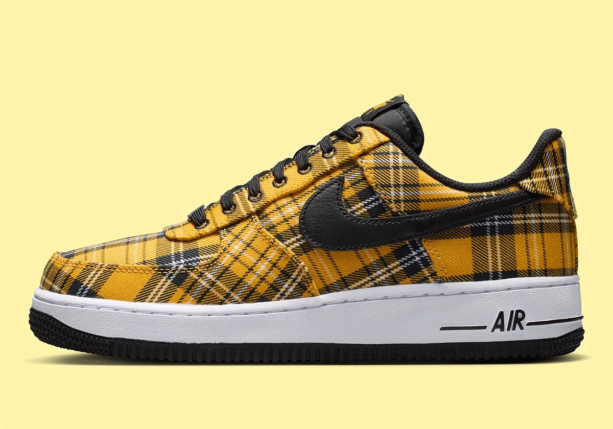 Nike Air Force 1 Low in yellow plaid with white upper and black trim, front three-quarter view - detail view 1