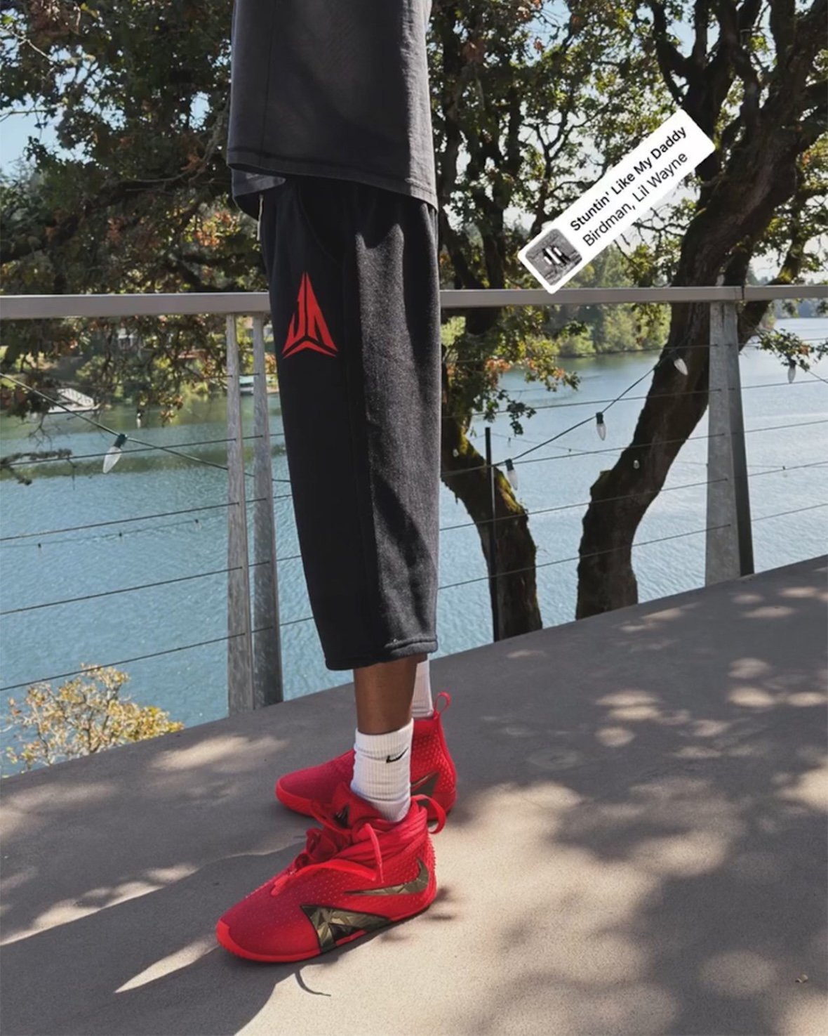 Nike Ja 4 High with wrapped exterior shell and triangular branding detail in high-top silhouette - detail view 4