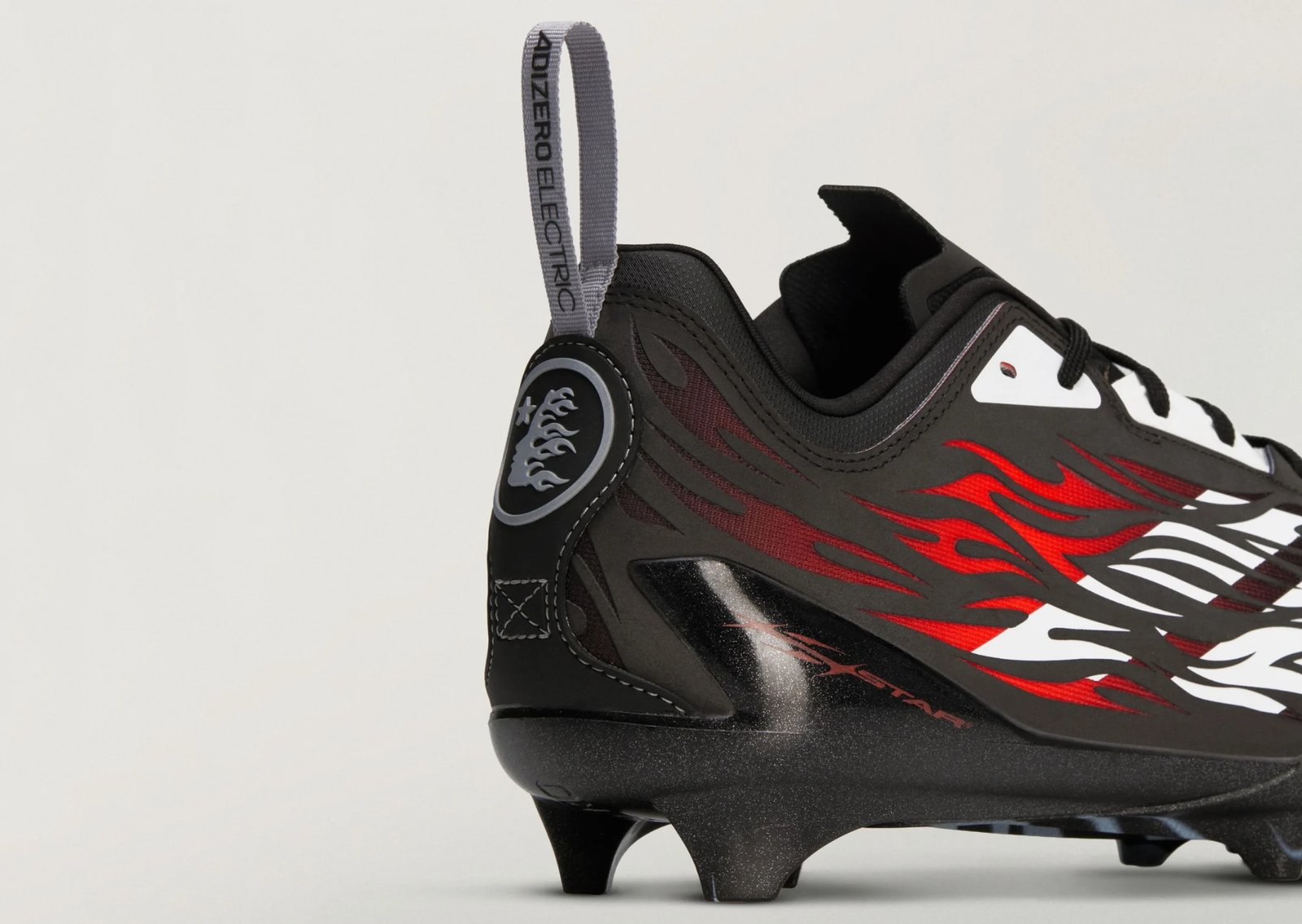 Hellstar x adidas Adizero Electric II Cleats Pack in black and red and black and white colorways featuring flame graphics across side panels and toebox - detail view 2