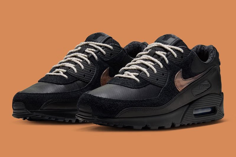 Wagyu x Nike Air Max 90 in Black and Anthracite with custom cow-head heel badge, featuring shaggy suede and perforated leather upper construction - detail view 3