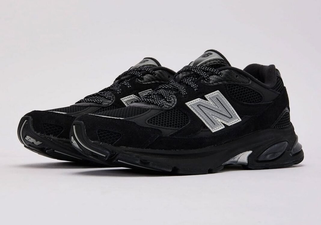 DTLR x New Balance 2010 Carbon Fiber exclusive sneaker with black mesh, silver N-logo branding, and carbon fiber heel detailing - detail view 1