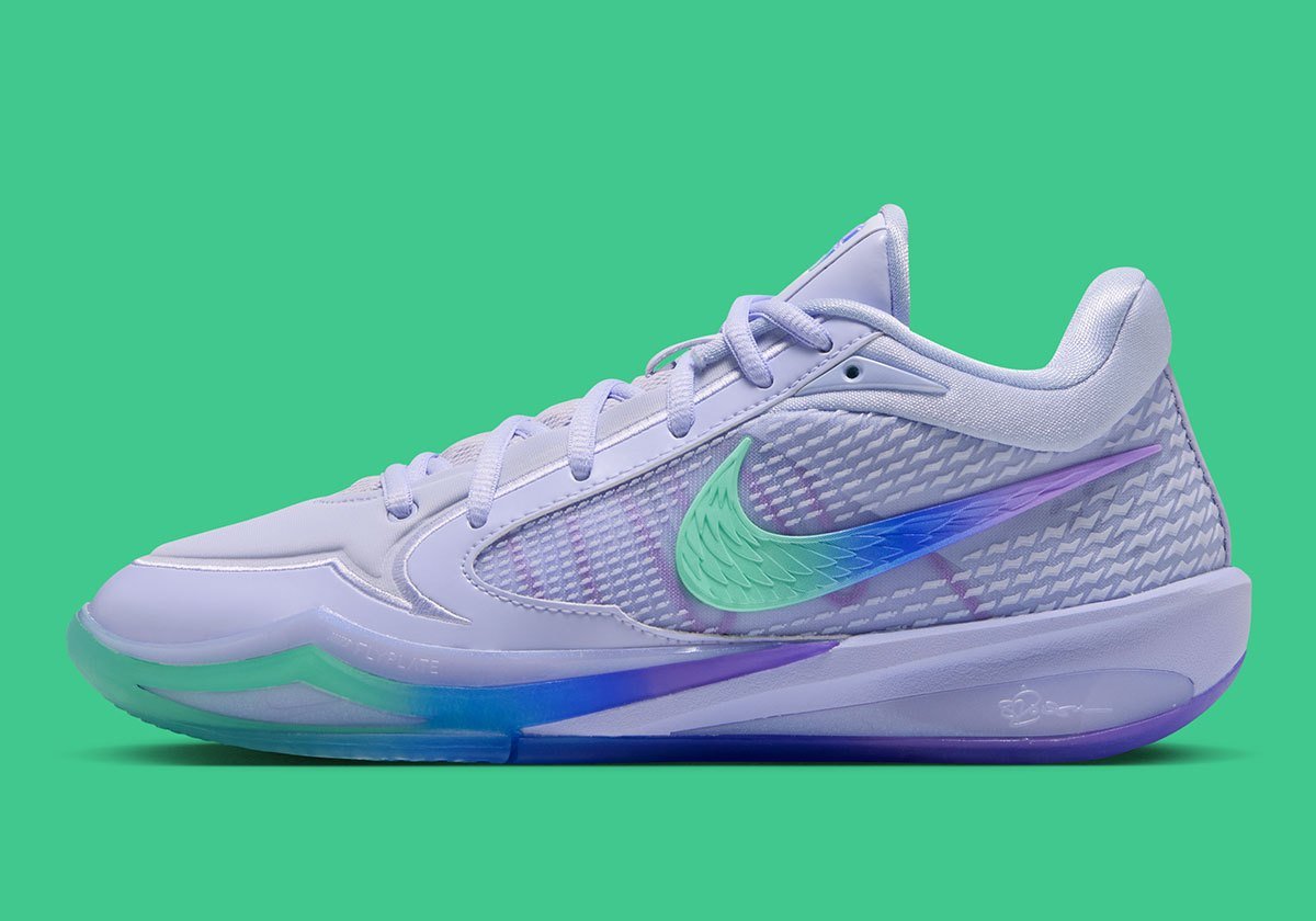 Nike Sabrina 4 Superstition colorway featuring pale purple upper with tri-tone gradient of Liberty green, royal blue, and metallic purple on the outsole and Swoosh - detail view 1