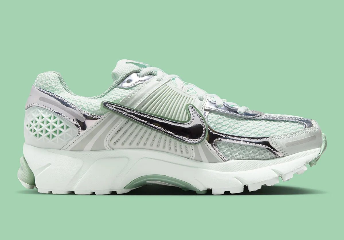 Nike Zoom Vomero 5 in Barely Green with metallic silver chrome accents and dual Swoosh detail - detail view 3