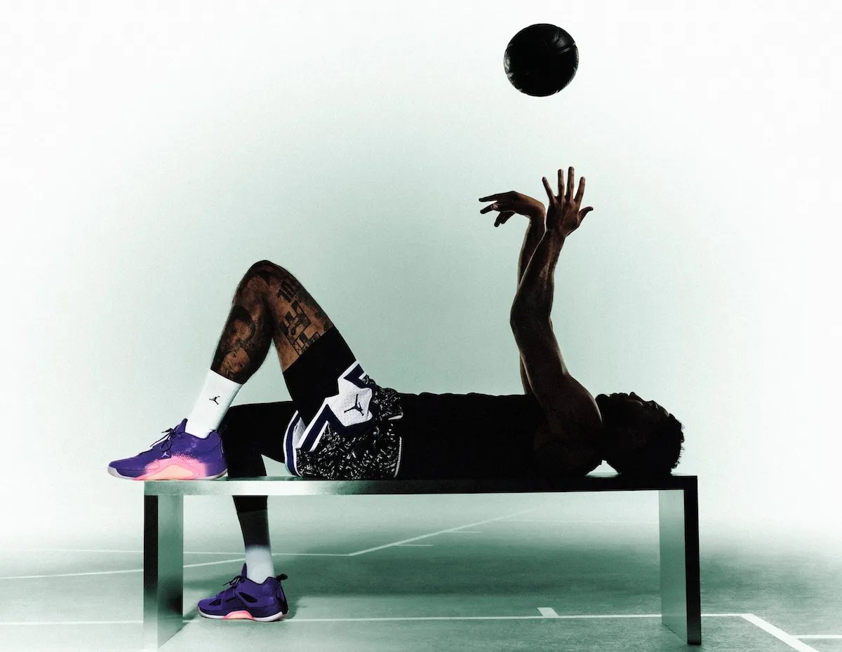 Jordan Brand Tatum 5 basketball shoe in Sunrise colorway, showcasing midfoot strap support and Air Zoom cushioning - detail view 2