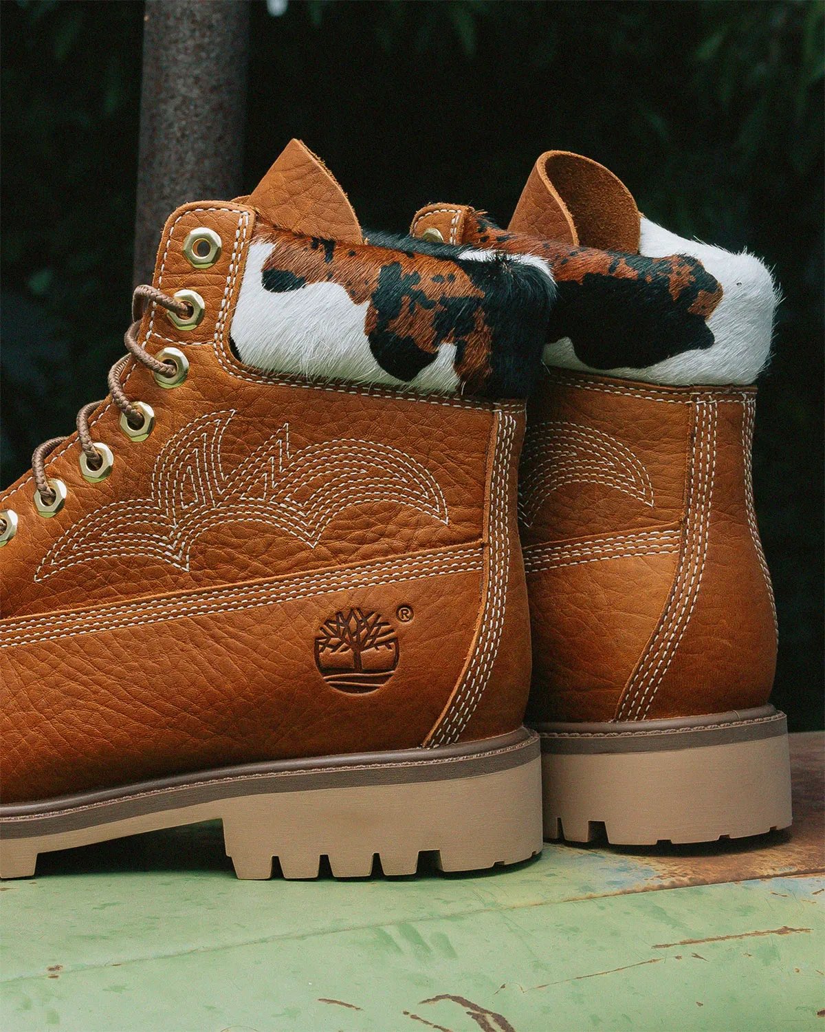 Sneaker Politics x Timberland 6-Inch Boot Outlaw and Rodeo editions featuring pebbled leather, Western stitching, and cow-print detailing - detail view 2