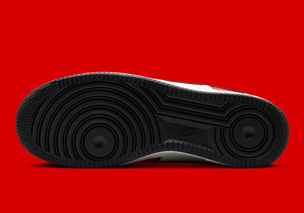 Nike Air Force 1 Low in University Red and black with diamond heel branding and Sail quarter panel - detail view 2