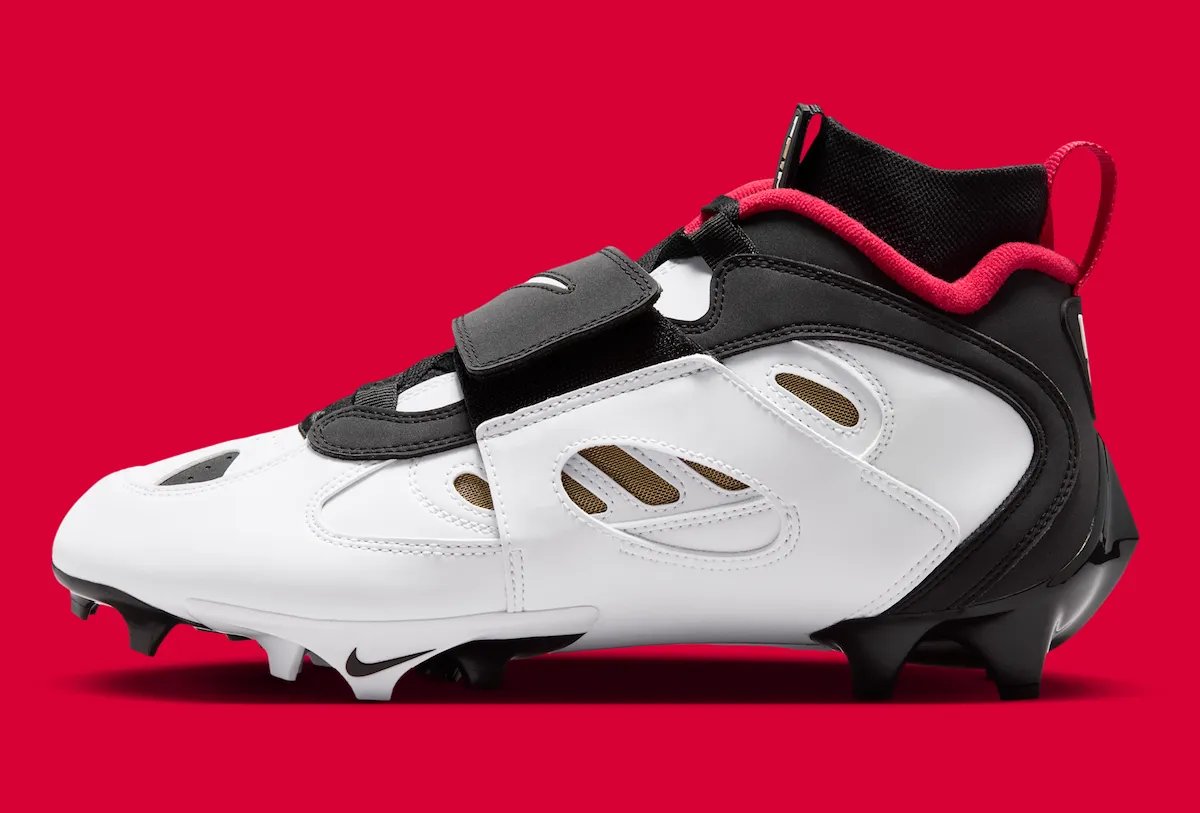 Nike Diamond Turf 2 49ers football cleat in black with prime red and metallic gold accents, Deion Sanders signature line - detail view 3