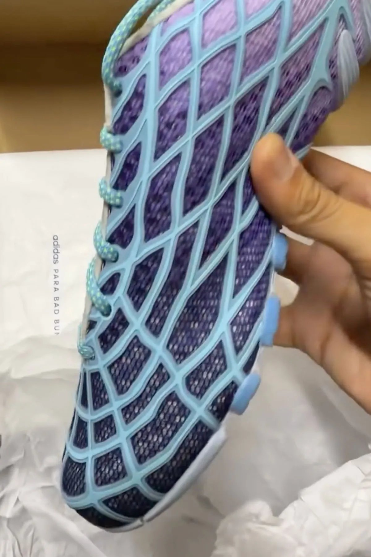 Bad Bunny x adidas F50 Ghost Sprint in purple and blue gradient colorway, showing F50 TPU skeletal upper paired with Ghost Sprint track outsole - detail view 2