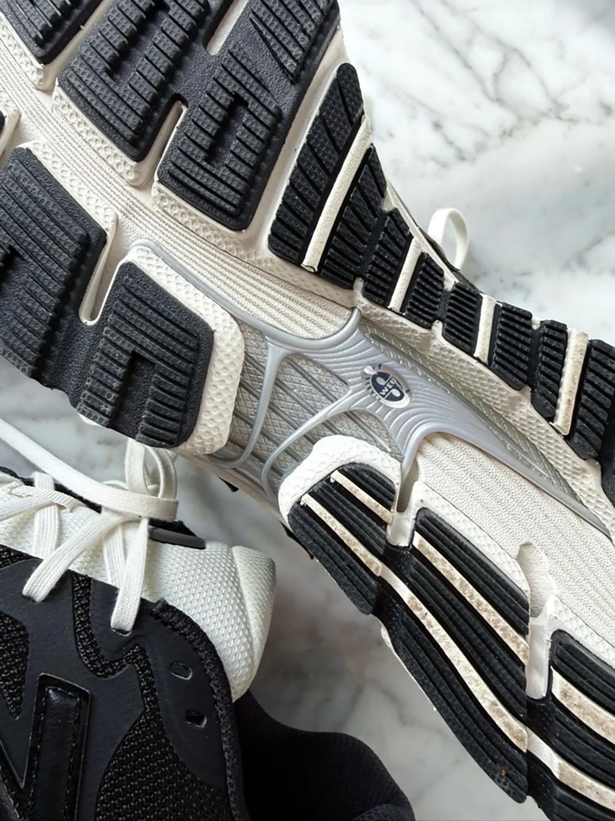 JJJJound x New Balance 1890 collaboration sneaker in black with aged off-white midsole and silver ABZORB detailing - detail view 3