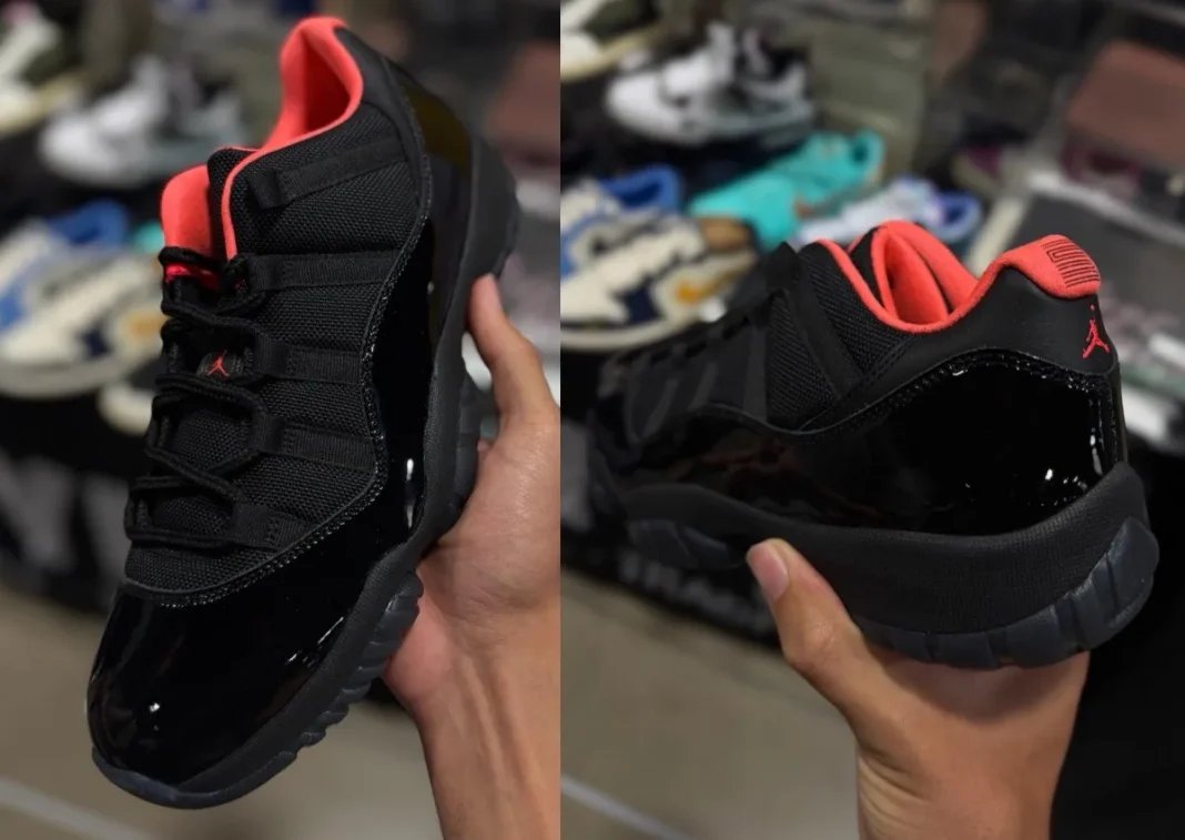 Air Jordan 11 Low Black Infrared sample featuring all-black patent leather upper with infrared sockliner and Jumpman branding - detail view 1
