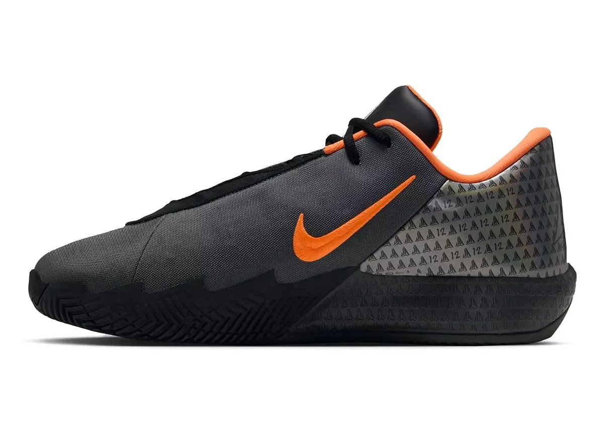 Nike Twelve Time in Black/Iron Grey/Orange colorway, Ja Morant signature takedown basketball shoe with burnt orange Swoosh and matte grey upper - detail view 3